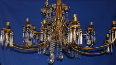 A good quality brass fourteen branch chandelier with brass lozenge droplet decoration,