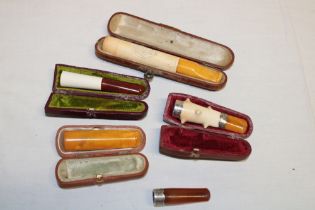 Three various meerschaum cheroot holders in velvet lined cases,