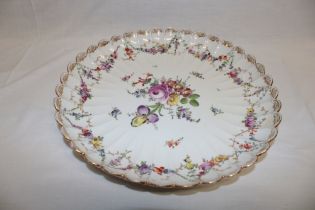 A German porcelain circular ornamental bowl with painted floral decoration,