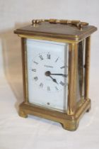 A carriage clock by Bayard with rectangular enamelled dial in brass traditional case (af)