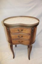 A French inlaid mahogany kidney-shaped chest of three small curved drawers below a white marble top