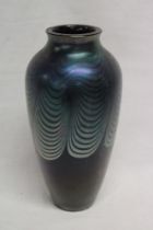 An art glass tapered vase by Okra with lustre lined decoration,