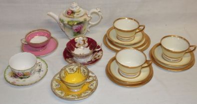 A selection of various Royal Worcester tea ware including four decorative tea cups and saucers,