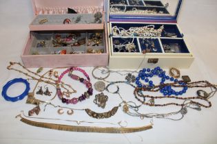 Two jewellery boxes containing a quantity of various costume jewellery