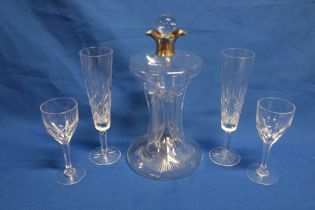 An unusual cut-glass slender liqueur decanter with silver mounted neck, Birmingham marks, 11½" high,