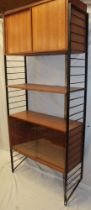 A 1960's Ladderex single bay shelving system with teak bookcase enclosed by two glazed doors,