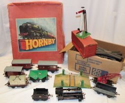 A selection of 0 gauge railway items including clockwork BR tank engine and tender,