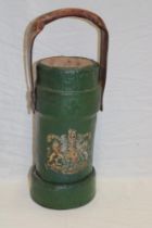 A First War canvas covered cylindrical ammunition shell holder with coat of arms decoration and