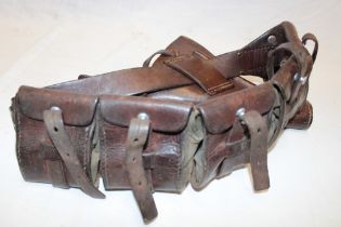 A First War brown leather five-pouch bandolier and a First War Webley brown leather revolver