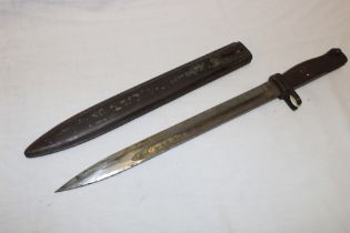 A First War German Ersatz bayonet with single edged blade and steel hilt in painted steel scabbard