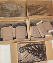 Five boxes containing book shop metal book stands and clear plastic book stands