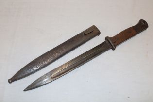 A Second War German K98 Mauser bayonet in steel scabbard with matching numbers