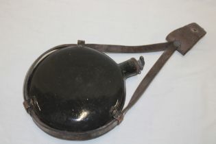 A First War enamelled water canteen with leather straps