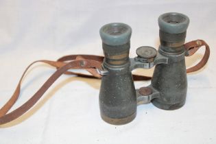 A pair of First War German grey and brass mounted military field binoculars