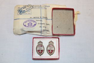 A pair of King's Commendation for Brave Conduct badges in original card box with bronze oak leaf