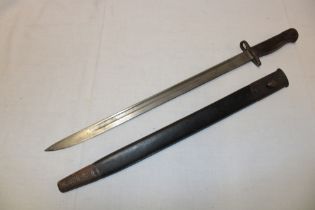 A First War 1907 pattern Lee Enfield bayonet dated '17 in steel mounted leather scabbard