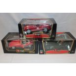 Three Burago mint and boxed 1/18 sports cars including Jaguar E,