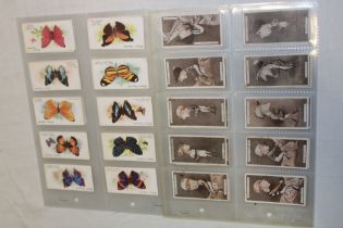 A set of Player's "Racing Caricatures" cigarette cards and a set of Player's butterfly cigarette