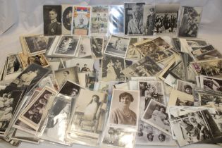 A large selection of various commemorative postcards,