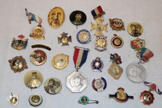 A collection of George V Coronation badges and medallions including some silver examples,