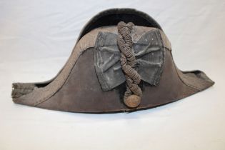 A post 1902 Royal Naval Officer's sealskin bi-corn hat with gilt braid by Gieves Limited (af)