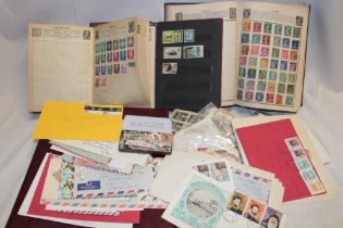 Two albums of mixed British Commonwealth and World stamps together with numerous stamps in packets,