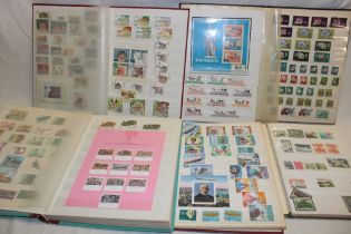 Six stock books containing a selection of thematic stamps including military, gemstones, horses,