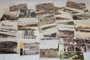 A large selection of various black and white postcards, scenic views,