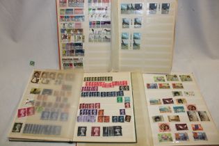 Two stock books containing a selection of stock books of GB stamps and one other stock book of