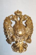 An Imperial Austrian brass double eagle helmet plate