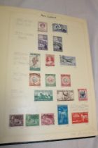 A folder album containing a collection of New Zealand used stamps 1936-2000