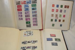 Four albums containing a selection of mixed GB stamps,