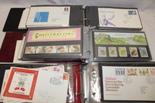 Three albums containing a collection of GB first day covers and presentation packs,