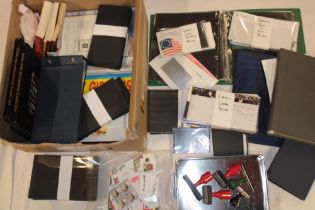 Two boxes containing a selection of stamp catalogues, empty definitive packs,