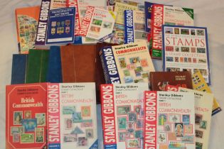 Various stamp catalogues, booklets, empty stock albums, empty cover album,