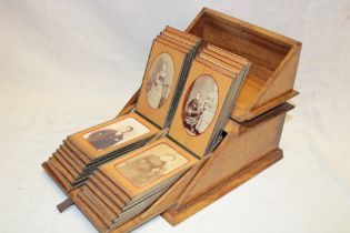 An unusual Victorian brass mounted walnut carte de visite display box containing a twin section of