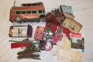 A selection of various red and green Meccano together with instruction books,