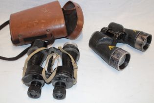 A pair of Second War Canadian 7x50 binoculars dated 1944 (af) in case of issue and one other pair