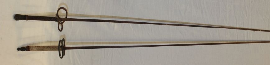 Two various fencing foils with square tapered blades and brass mounted handles