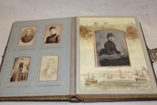 A Victorian family photograph album containing various cabinet photographs and carte de visites,