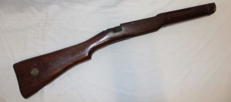A polished walnut military rifle stock