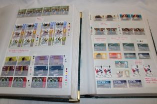 Two albums containing a large collection of GB EIIR mint stamps,