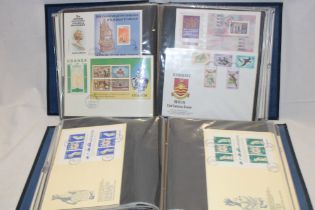 Two albums containing a collection of Commonwealth first day covers, mini sheets, etc,