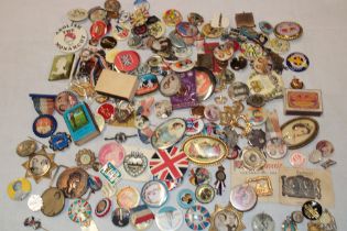 A large selection of George VI and Elizabeth II Coronation and commemorative badges, medallions,