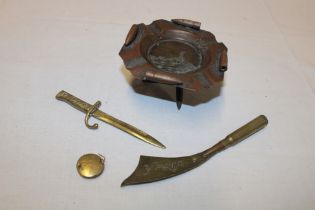 A First War trench art brass ashtray commemorating Hill 60 with bullet decoration on crossed bullet