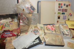 Two boxes containing a large selection of mixed World stamps in packets including some early