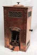 An unusual Cornish copper miniature stove with beaten and riveted front and sides and fret-work