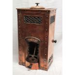 An unusual Cornish copper miniature stove with beaten and riveted front and sides and fret-work