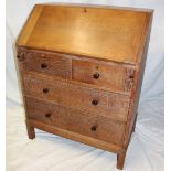 A 1930's/40's limed oak bureau by Heal & Son Limited London with pigeon holes and drawers enclosed