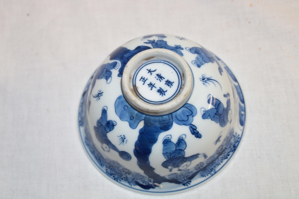 A 19th century Chinese circular bowl with blue and white figure decoration, signed, - Image 2 of 2